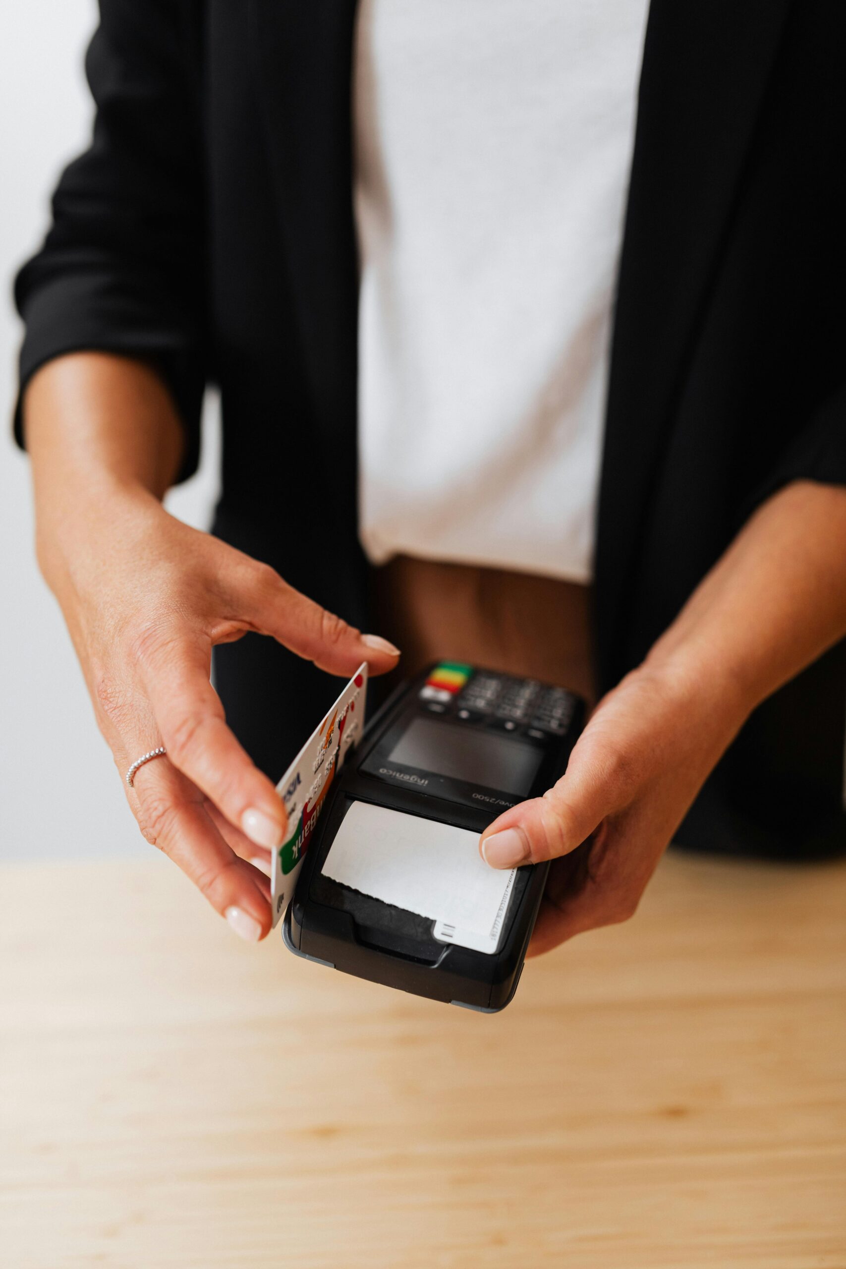 a woman using her bank card on an payment machine