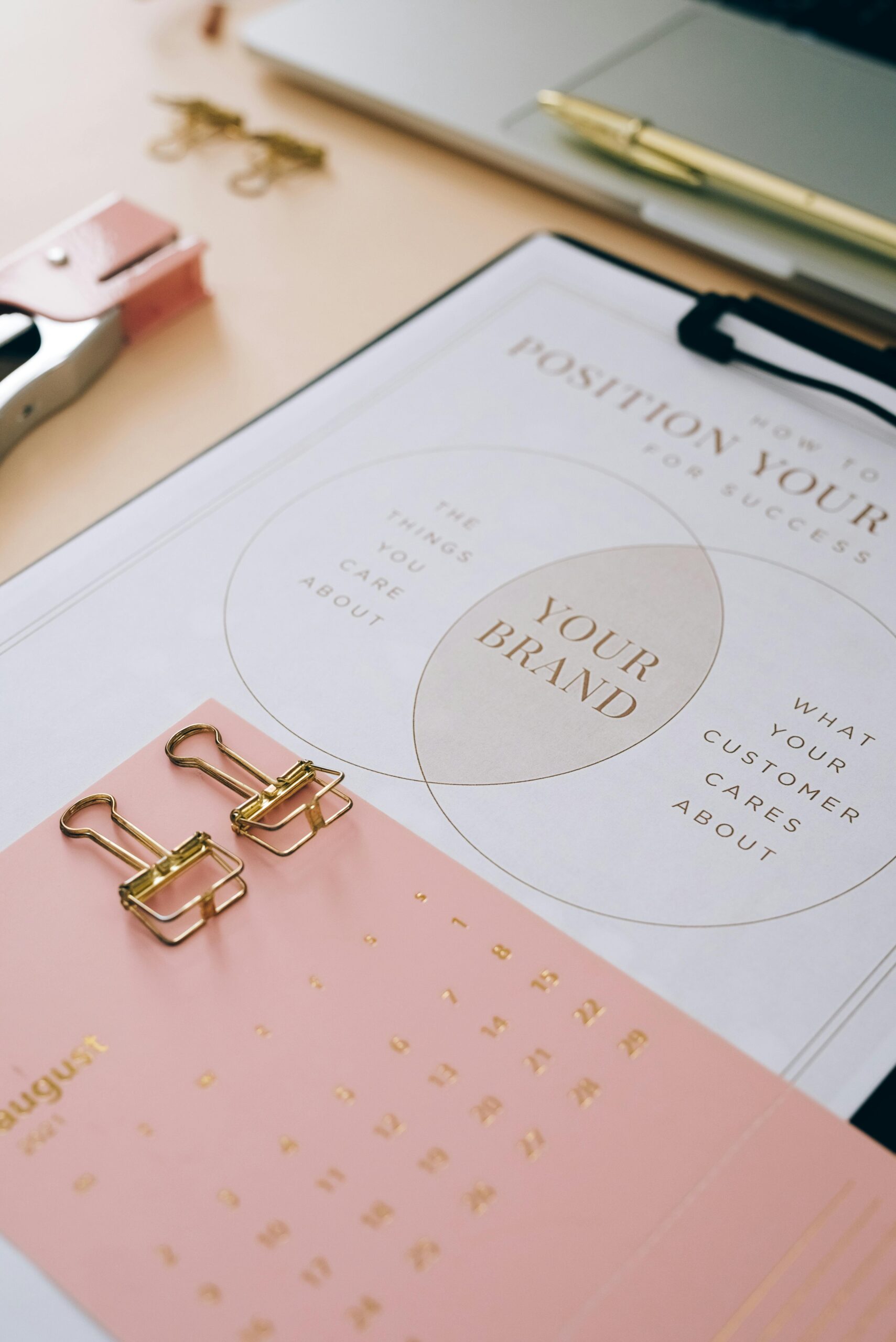 brand planner calendar with clips and pens on the side of planner