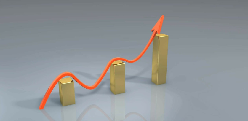 arrow of growth showing increase in golden color bars