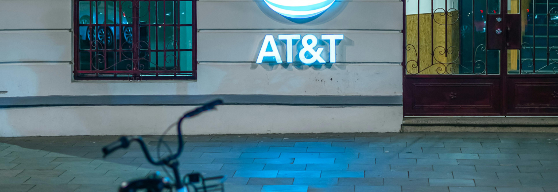 AT&T logo on a building with a bicycle parked in front